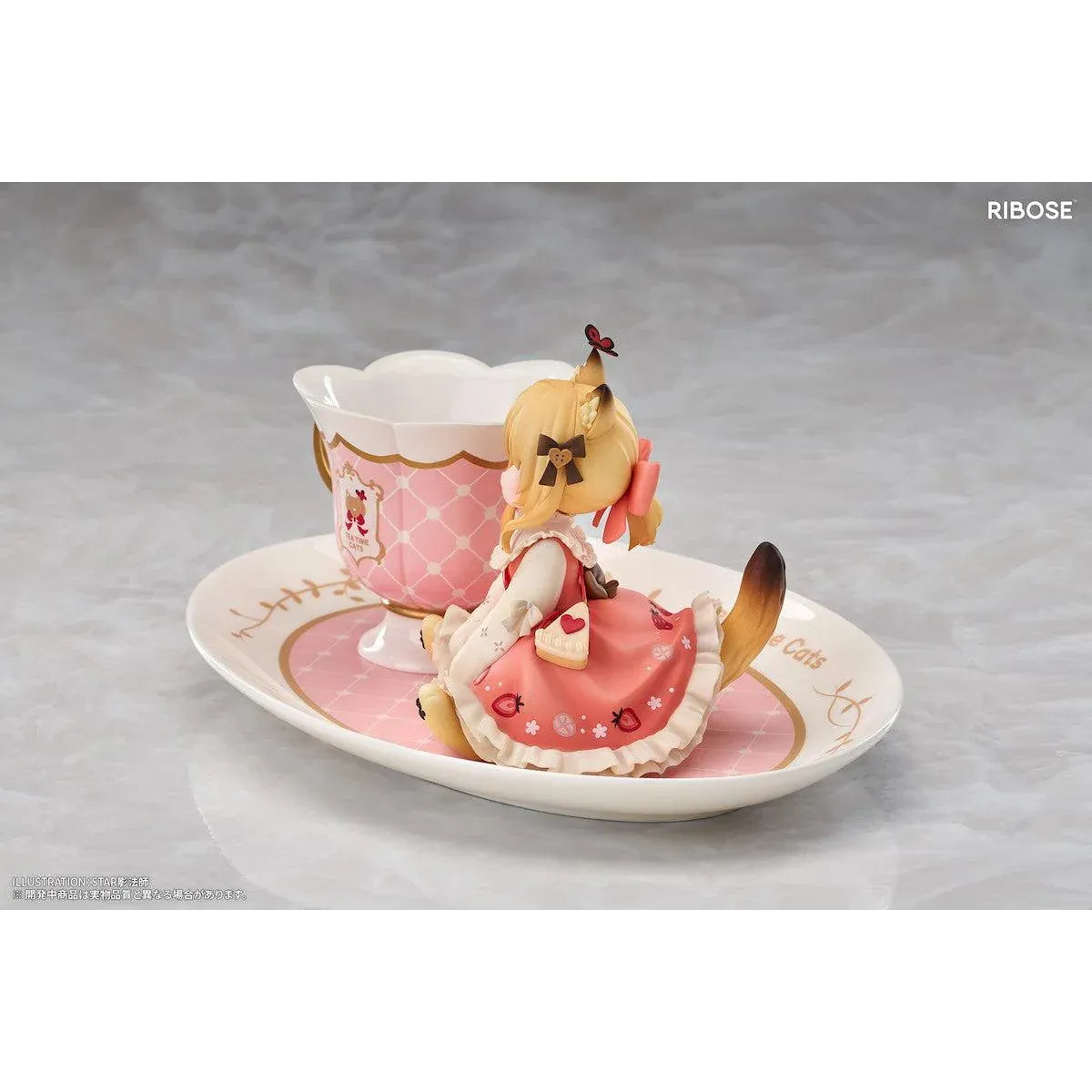 DLC Series Tea Time Cats Orange Cat Non Scale Figure by RIBOSE featuring an orange-haired cat girl with green eyes, a pink outfit, fluffy cat ears, and paw-shaped sleeves sitting beside a decorative pink teacup on a matching serving tray.