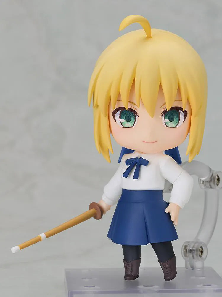 Fate stay night Nendoroid Saber Casual Outfit Ver. Figure featuring Saber with blonde hair, green eyes, white blouse, blue skirt, and sword accessory.