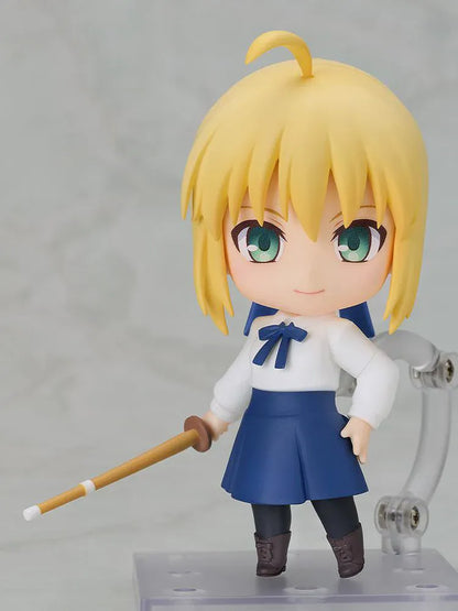 Fate stay night Nendoroid Saber Casual Outfit Ver. Figure featuring Saber with blonde hair, green eyes, white blouse, blue skirt, and sword accessory.