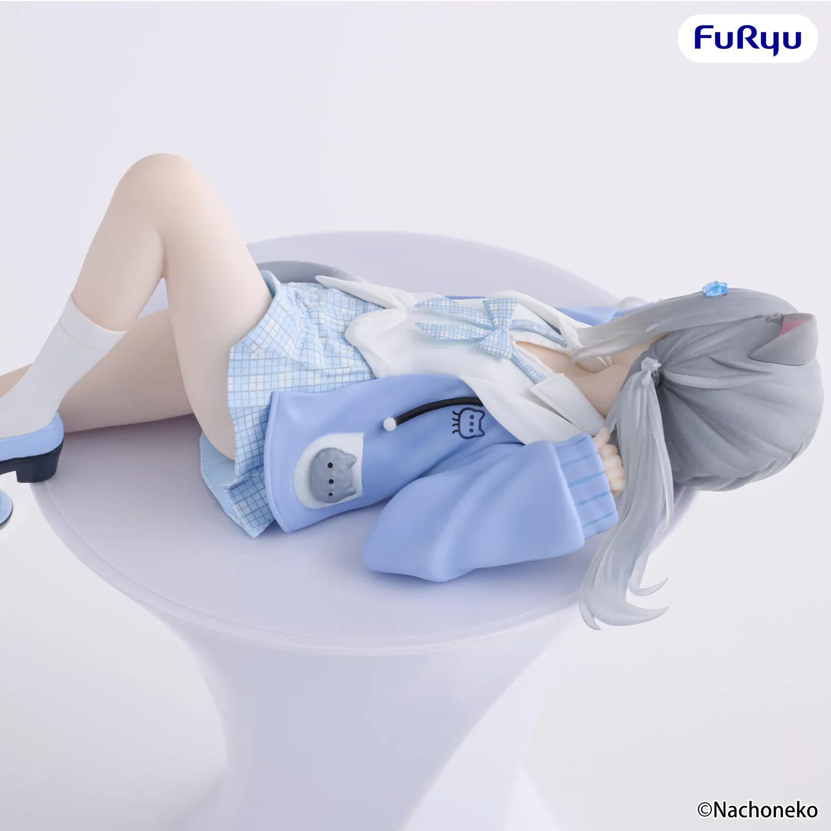 Nachoneko Noodle Stopper Figure by FuRyu featuring Nachoneko lying down in a blue outfit with cat ears and a cushion base.