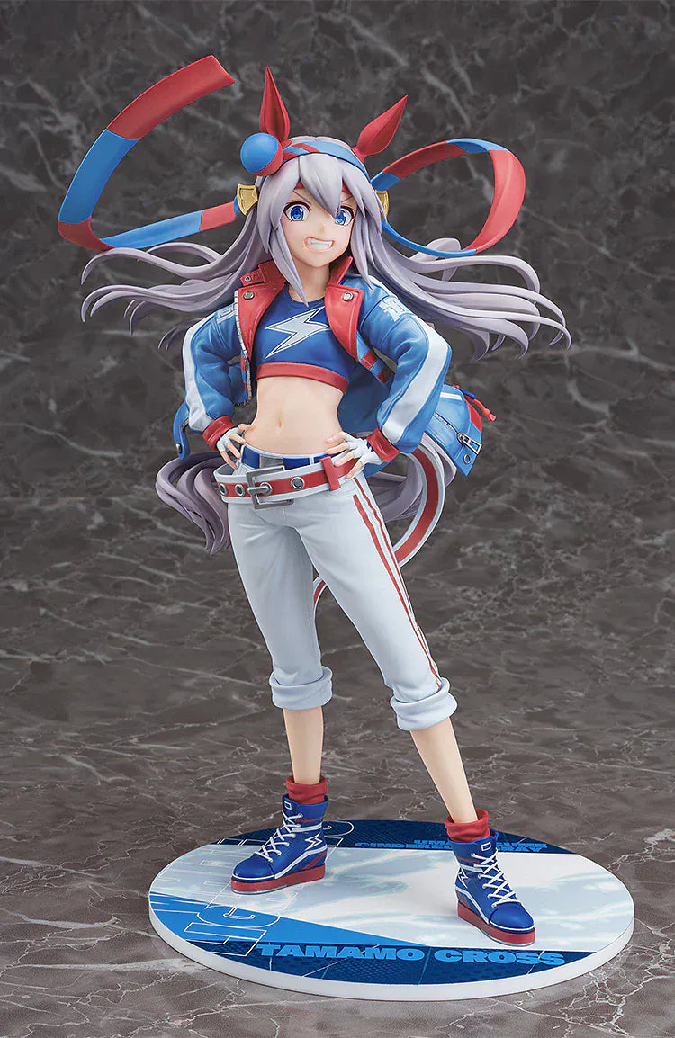 Uma Musume: Cinderella Gray Tamamo Cross 1/7 Scale Figure featuring Tamamo Cross in her vibrant blue and red racing jacket with confident pose and long flowing twin tails.