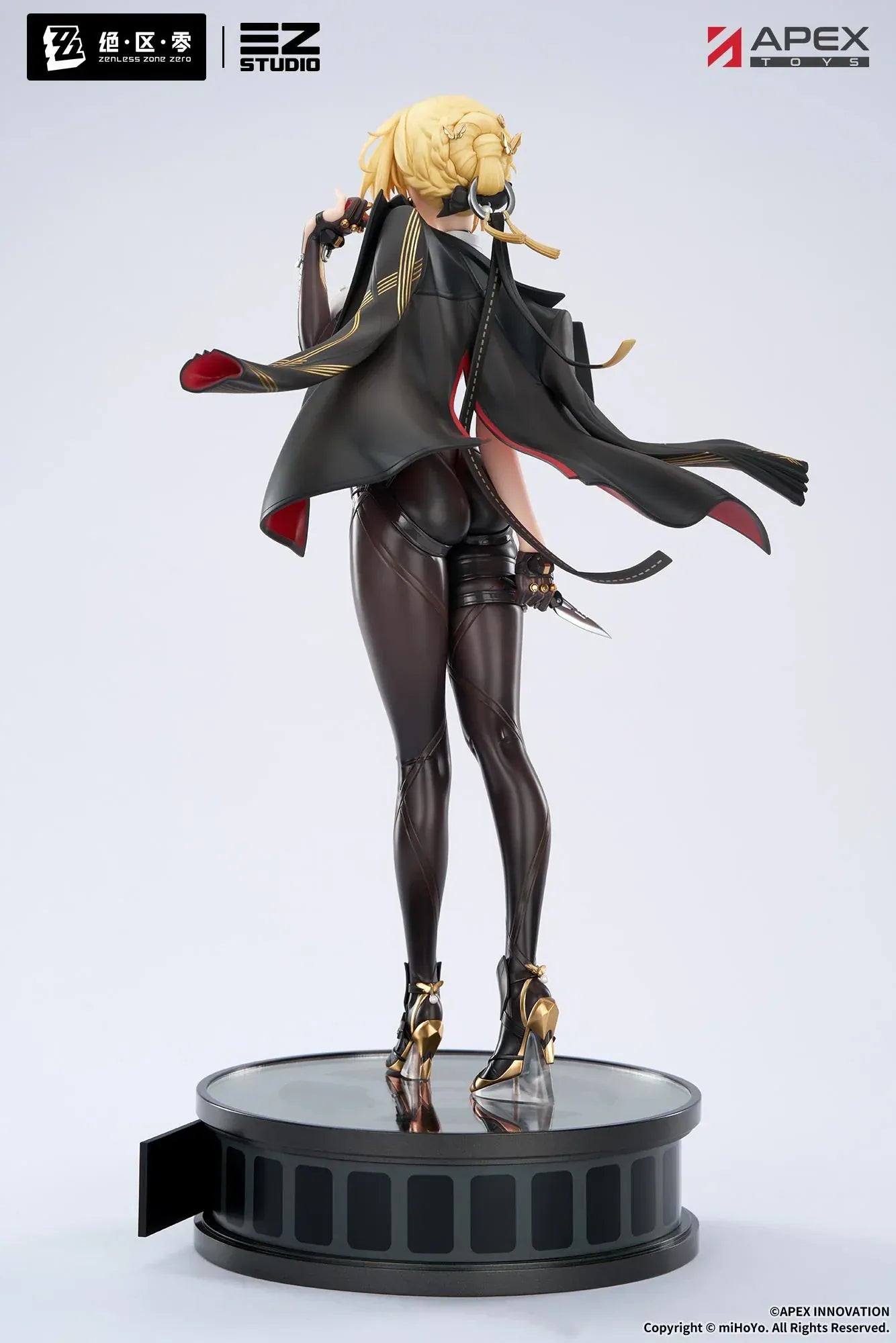 Zenless Zone Zero Evelyn Chevalier 1/7 scale figure by APEX Toys standing on display base wearing black combat outfit with red-lined cape.