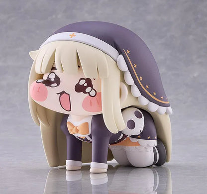 Petite Speaki soft vinyl figure with blonde hair, rosy cheeks, sparkling eyes, and a dark hood with gold accents.