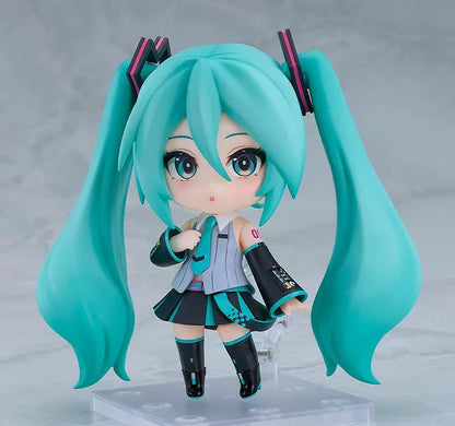 Hatsune Miku V6 Nendoroid figure with turquoise twin tails, an updated outfit, and interchangeable accessories.