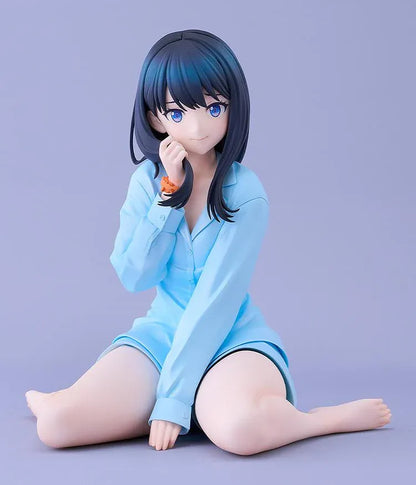 GRIDMAN UNIVERSE Rikka Takarada Pajamas Ver. figure seated in light blue pajamas, with dark hair, blue eyes, and an orange wrist scrunchie.