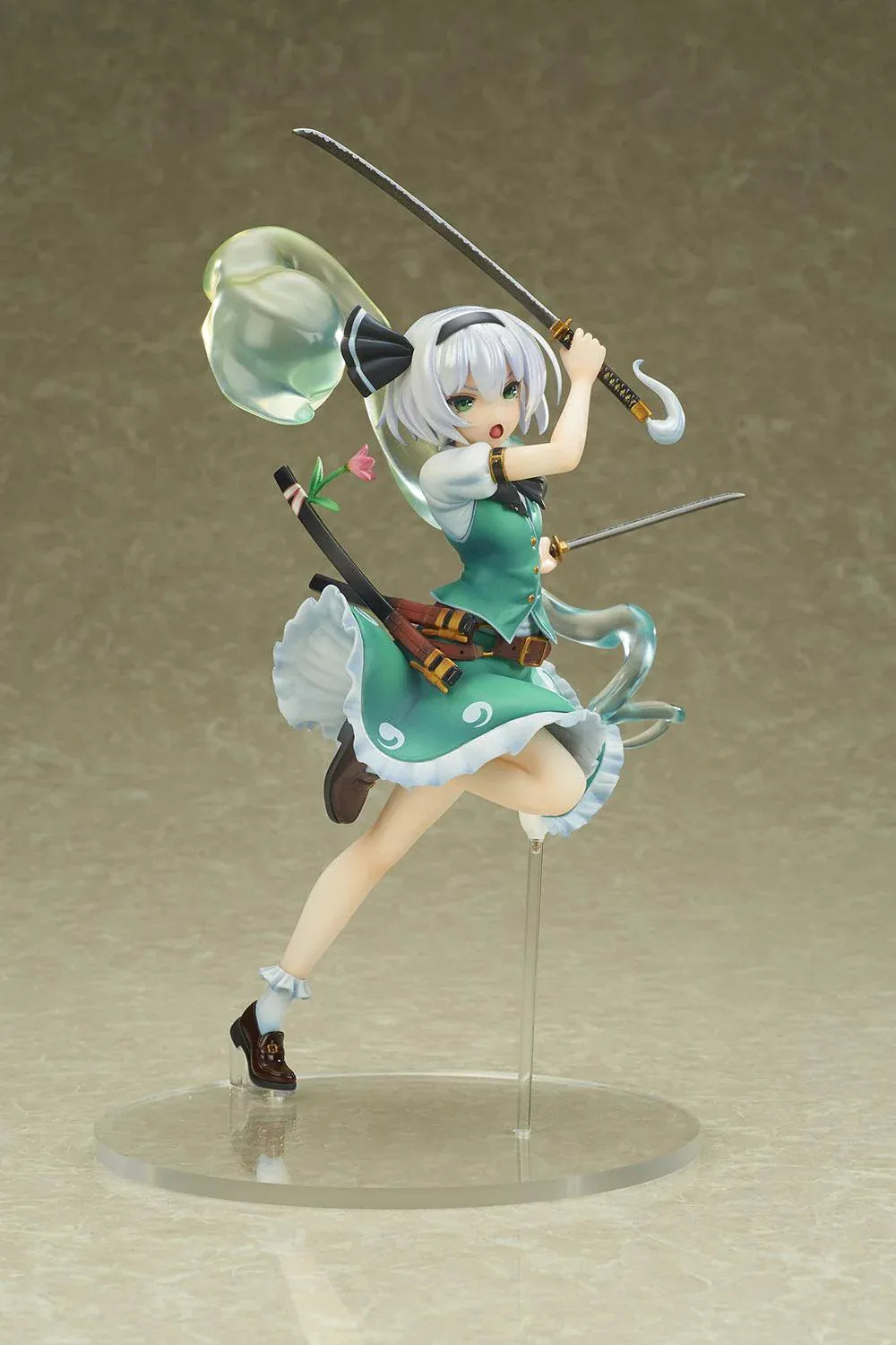 Touhou Project Youmu Konpaku figure wielding two swords in an airborne pose, wearing a green outfit with a translucent swirling spirit effect.
