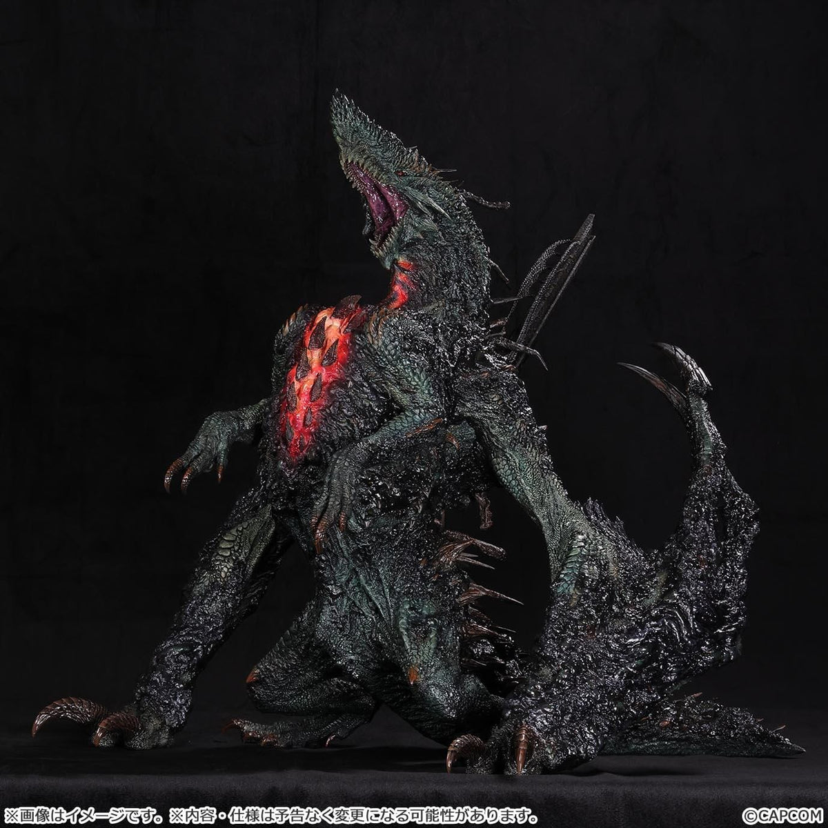 Monster Hunter Gogmazios Creator's Model XL figure roaring with dark textured scales, jagged spines, large claws, and red-orange chest accents.
