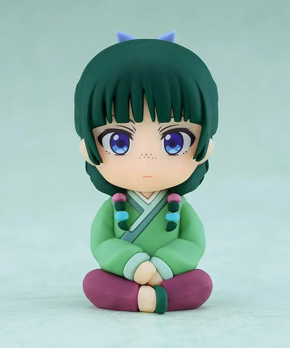 The Apothecary Diaries Nendoroid Plus Maomao rubber mascot seated in a green palace attendant outfit.