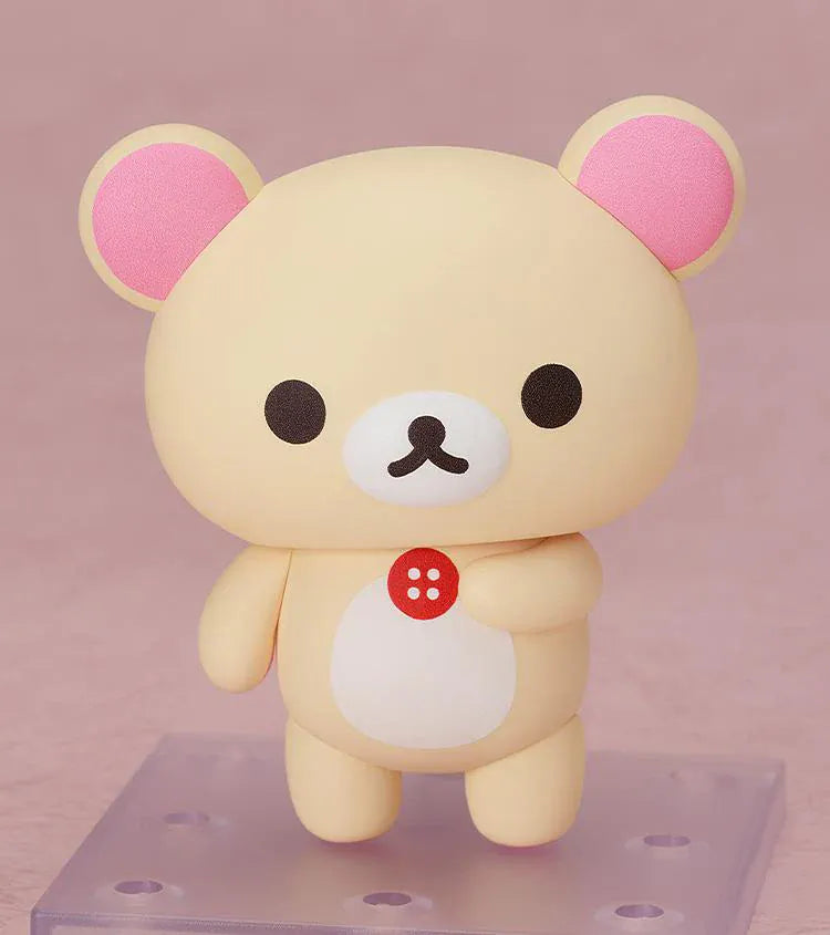 Rilakkuma Nendoroid Korilakkuma Figure with cream-colored bear design, pink ears, red button detail, white belly, and chibi display base