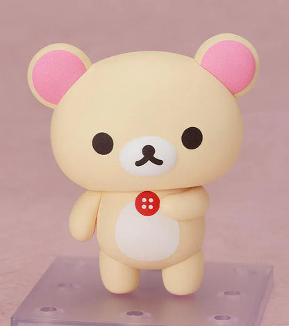 Rilakkuma Nendoroid Korilakkuma Figure with cream-colored bear design, pink ears, red button detail, white belly, and chibi display base