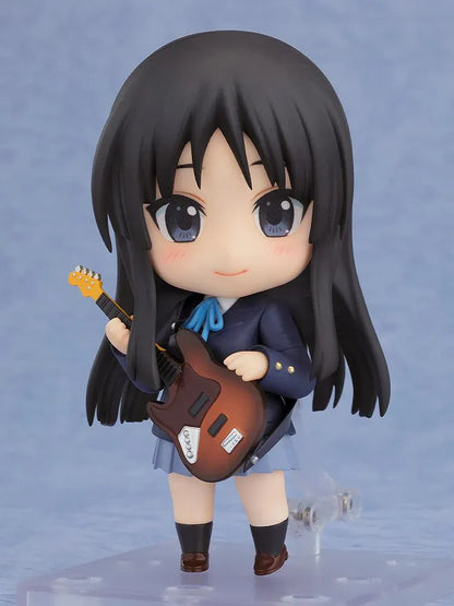K-ON! Nendoroid Mio Akiyama 2.0 figure with long black hair, her school uniform, blue ribbon, and left-handed bass guitar.
