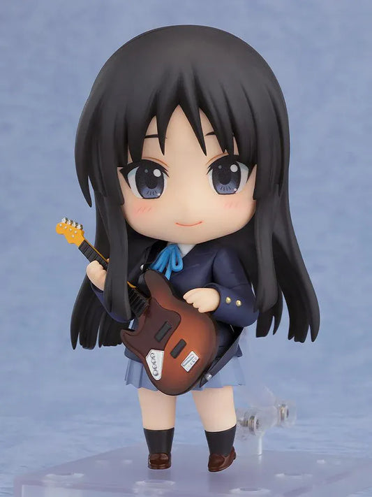 K-ON! Nendoroid Mio Akiyama 2.0 figure with long black hair, her school uniform, blue ribbon, and left-handed bass guitar.