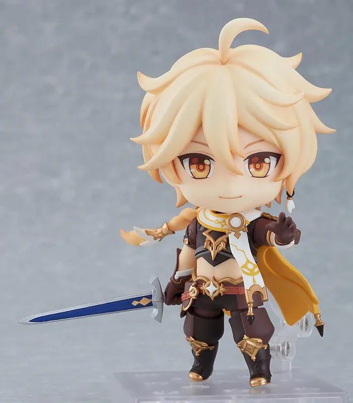 Genshin Impact Nendoroid Traveler Figure Aether Rerelease featuring Aether with blonde hair, golden eyes, fantasy outfit details, yellow cape, and sword accessory.