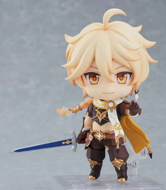Genshin Impact Nendoroid Traveler Figure Aether Rerelease featuring Aether with blonde hair, golden eyes, fantasy outfit details, yellow cape, and sword accessory.