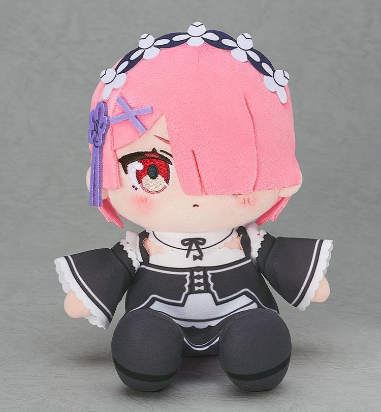 Rezero Starting Life in Another World Ram Chocopuni Plushie (Rerelease) featuring short pink hair covering one eye, a red embroidered eye, purple hair accessories, a floral headband, and a black and white maid outfit in a seated chibi design.