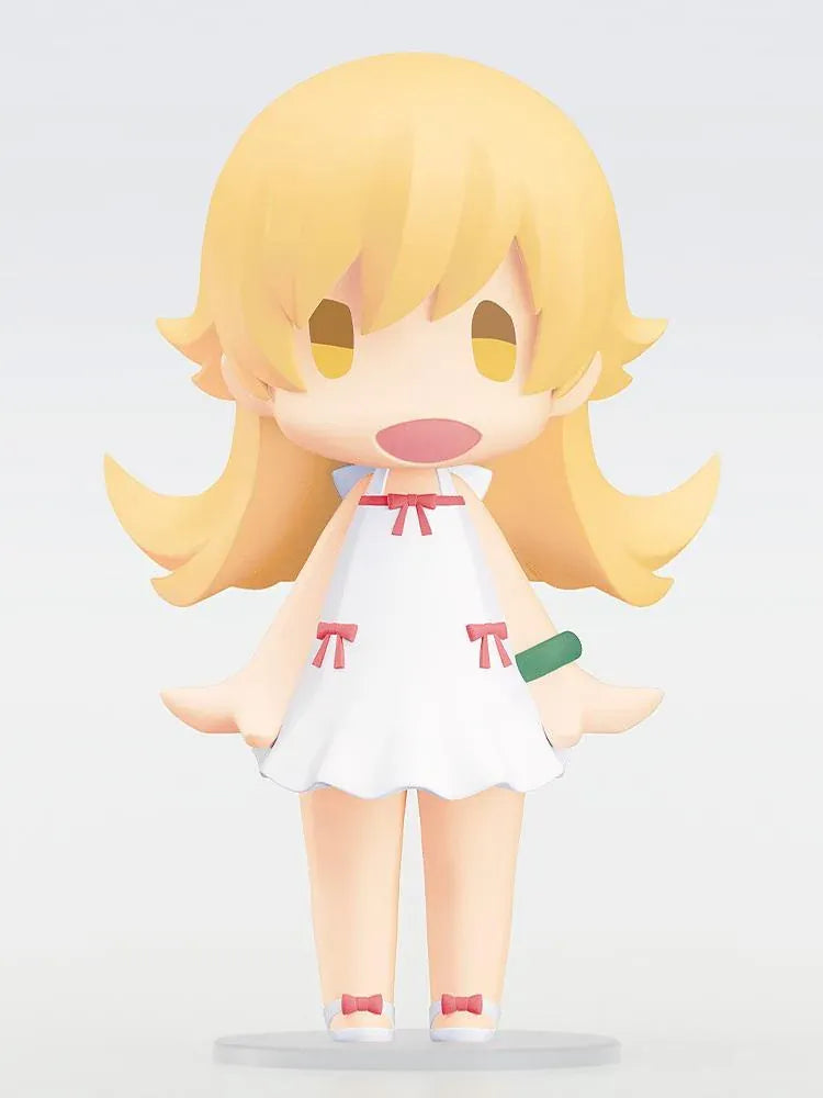 Monogatari Series HELLO! GOOD SMILE Shinobu Oshino Figure featuring a blonde-haired anime girl with golden eyes, a cheerful expression, white dress decorated with red bows, and matching shoes in a cute chibi design.