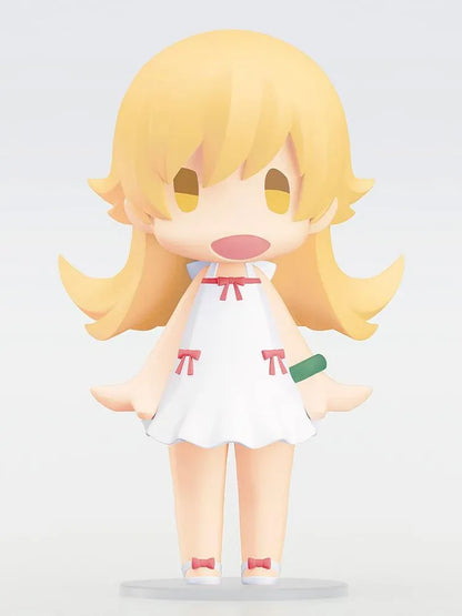 Monogatari Series HELLO! GOOD SMILE Shinobu Oshino Figure featuring a blonde-haired anime girl with golden eyes, a cheerful expression, white dress decorated with red bows, and matching shoes in a cute chibi design.