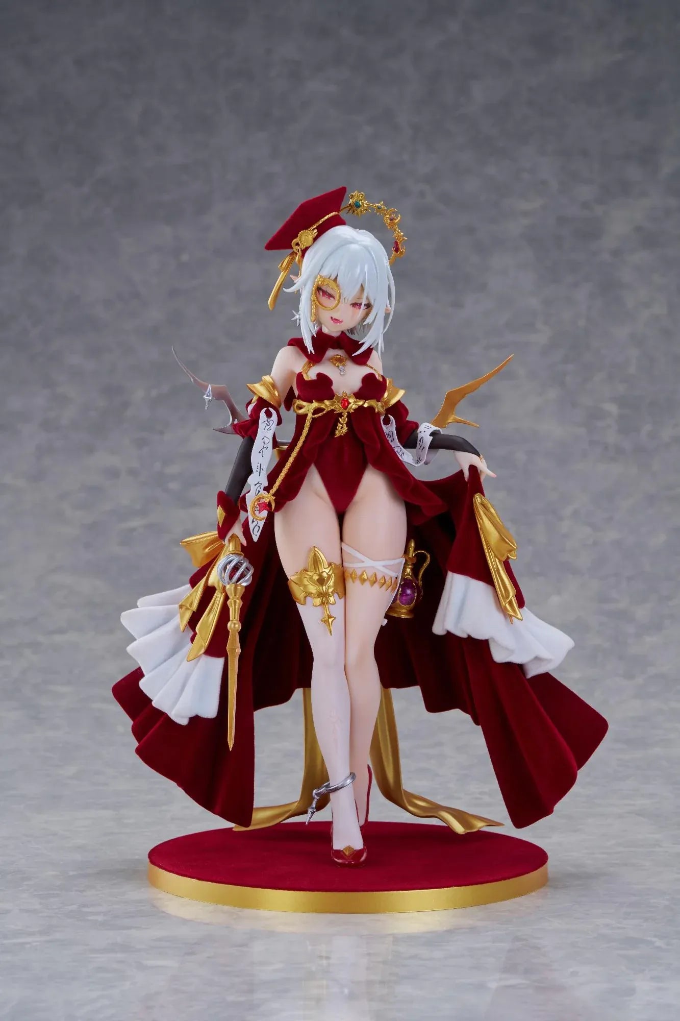 Alchemist Formal Dress Ver. 1/7 Scale Figure featuring a white-haired character in a red formal dress with gold accessories, ornate staff, cape, and red display base.
