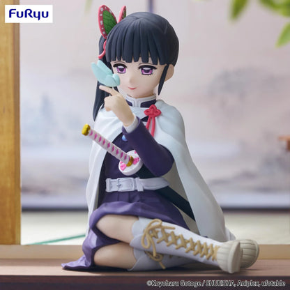 Kanao Tsuyuri Noodle Stopper figure seated in her Demon Slayer uniform and white cape while holding a blue butterfly.