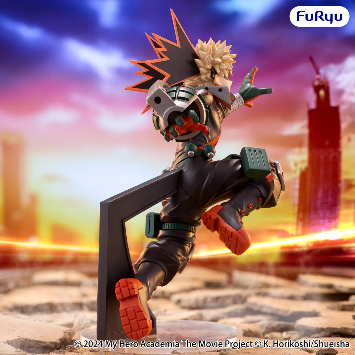 Katsuki Bakugo Muchute figure in his hero costume performing a dynamic airborne attack pose with grenade-shaped gauntlets.