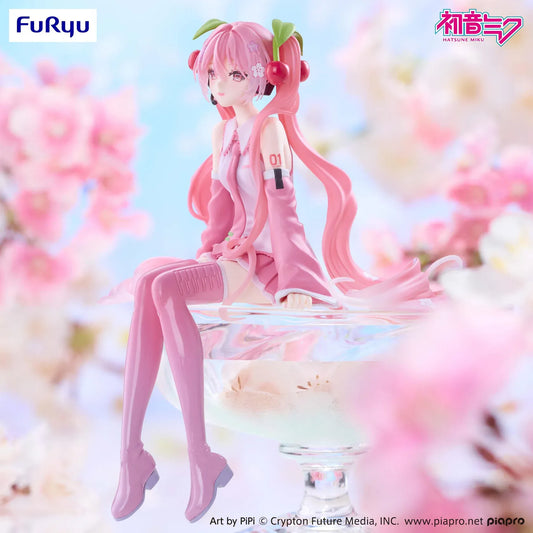 Sakura Miku 2026 Smile Ver. Noodle Stopper figure seated with dangling legs, pink twin tails, cherry hair ornaments, a white and pink outfit, and glossy pink boots.