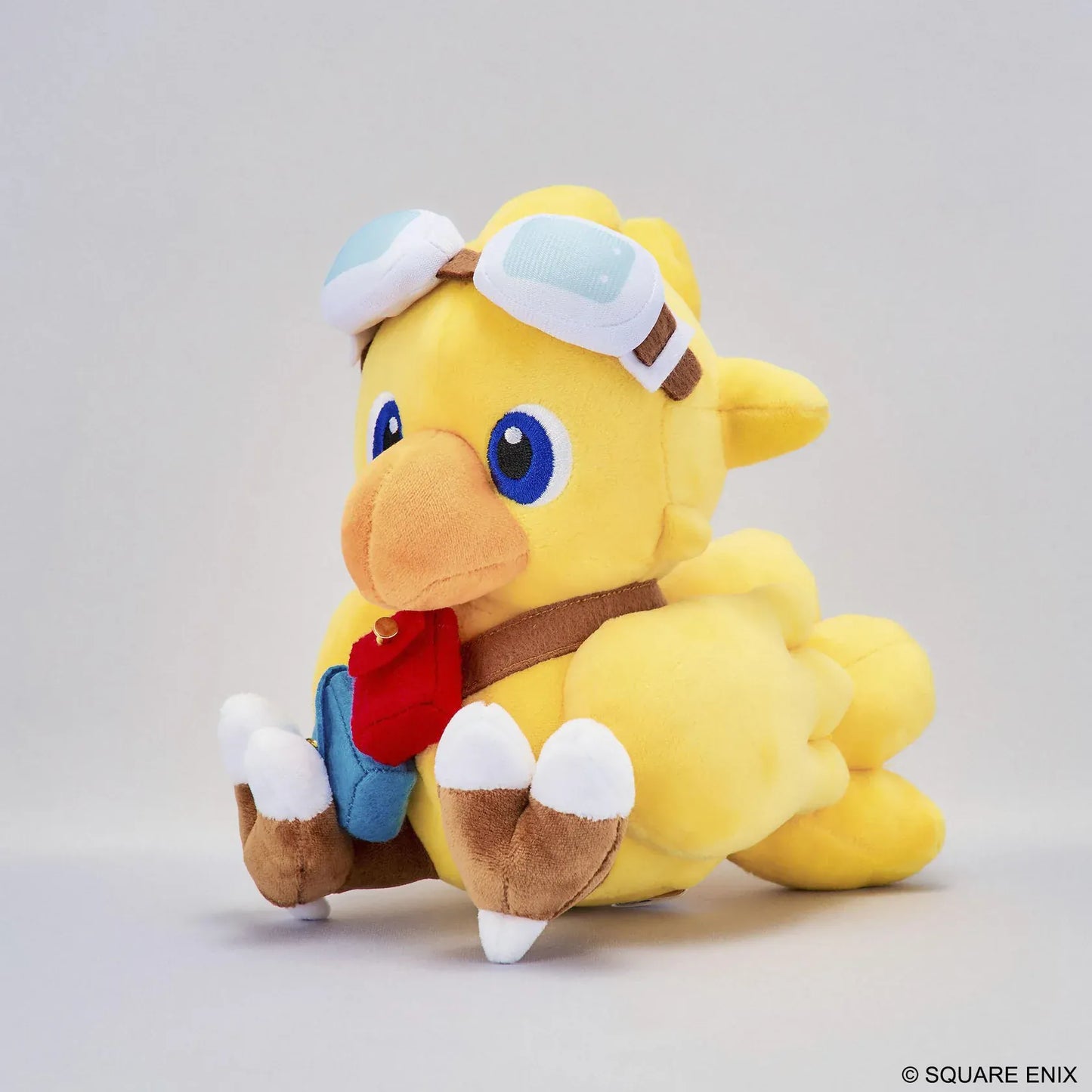 Final Fantasy Chocobo Chocobo and the Airship Ver. Plush with yellow Chocobo, pilot goggles, travel bag, blue embroidered eyes, and seated plush design