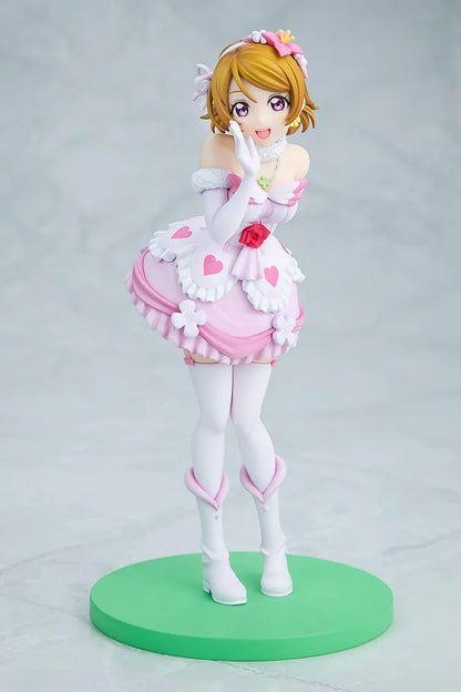 Love Live School Idol Project Hanayo Koizumi Bokutachi wa Hitotsu no Hikari Ver. Figure featuring Hanayo in a pink and white idol outfit with heart details, flower accents, and green display base.