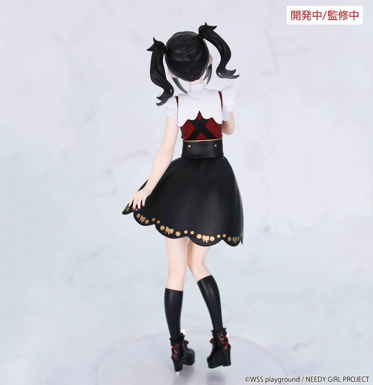 Prototype NEEDY GIRL OVERDOSE Vivit AME-CHAN figure with black twin ponytails, a red-and-black dress, gold-colored details, and platform boots.