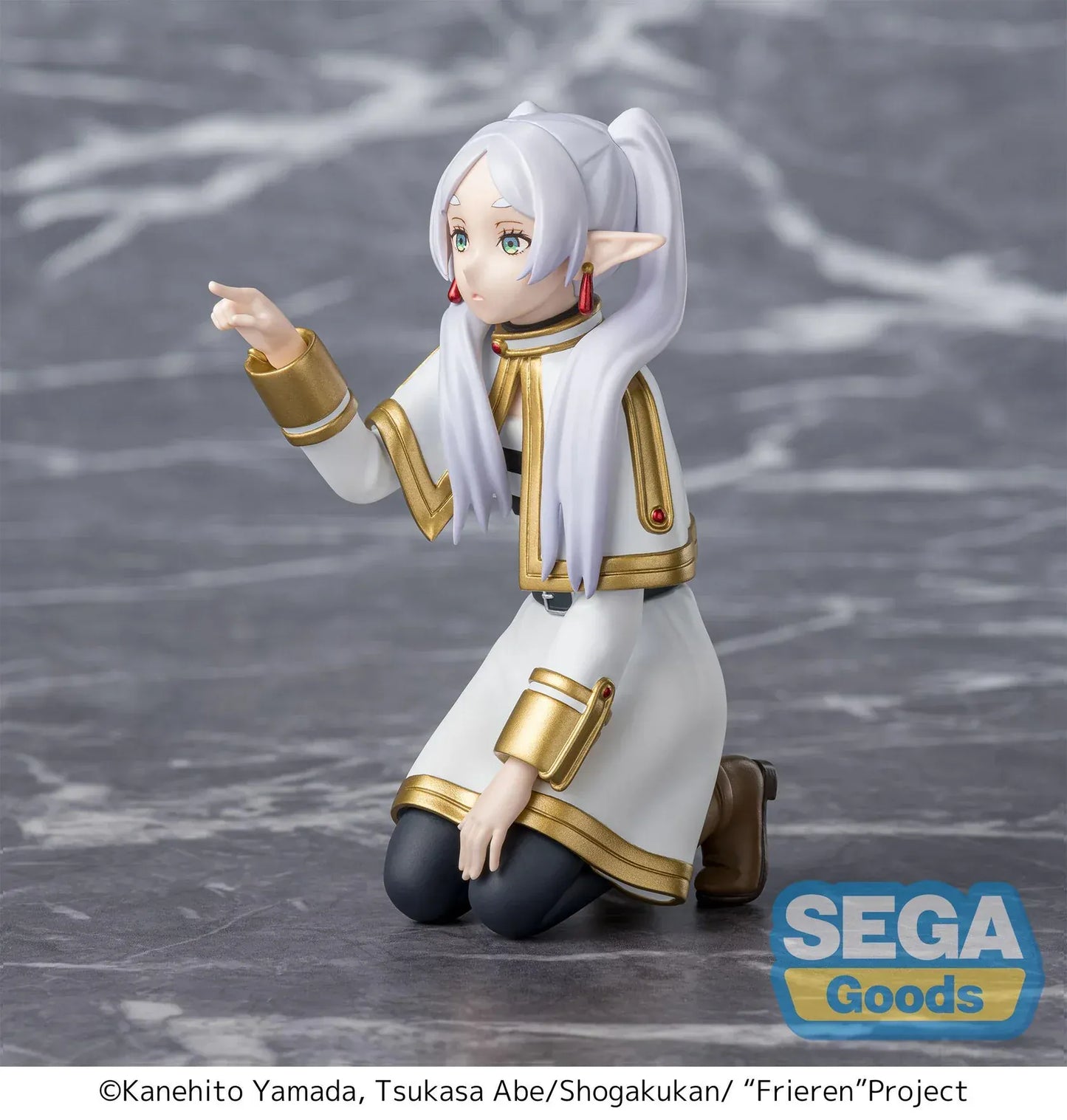 Perching figure of Frieren from Frieren: Beyond Journey’s End kneeling on a stone-like base, reaching forward to poke something, with long silver hair, elf ears, and a white-and-gold outfit.