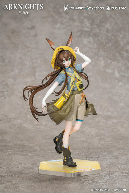 Arknights Gift+ Amiya Wildlight Wander Ver. 1/8 Scale Figure featuring Amiya with rabbit ears, hooded outfit, camera accessory, yellow bag, and themed display base.