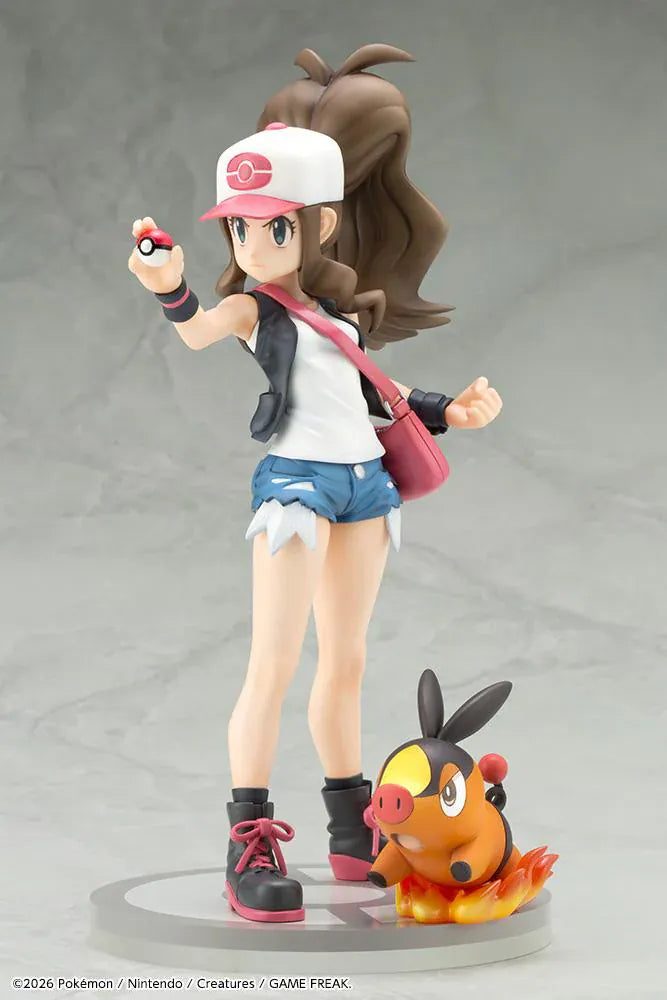 Pokemon ArtFX J Hilda with Tepig 1/8 Scale Figure Rerun featuring Hilda in her trainer outfit holding a Poké Ball with Tepig and flame effect on a display base.