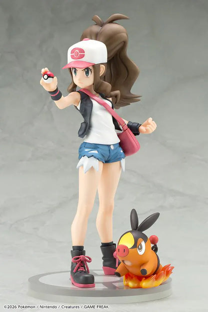 Pokemon ArtFX J Hilda with Tepig 1/8 Scale Figure Rerun featuring Hilda in her trainer outfit holding a Poké Ball with Tepig and flame effect on a display base.