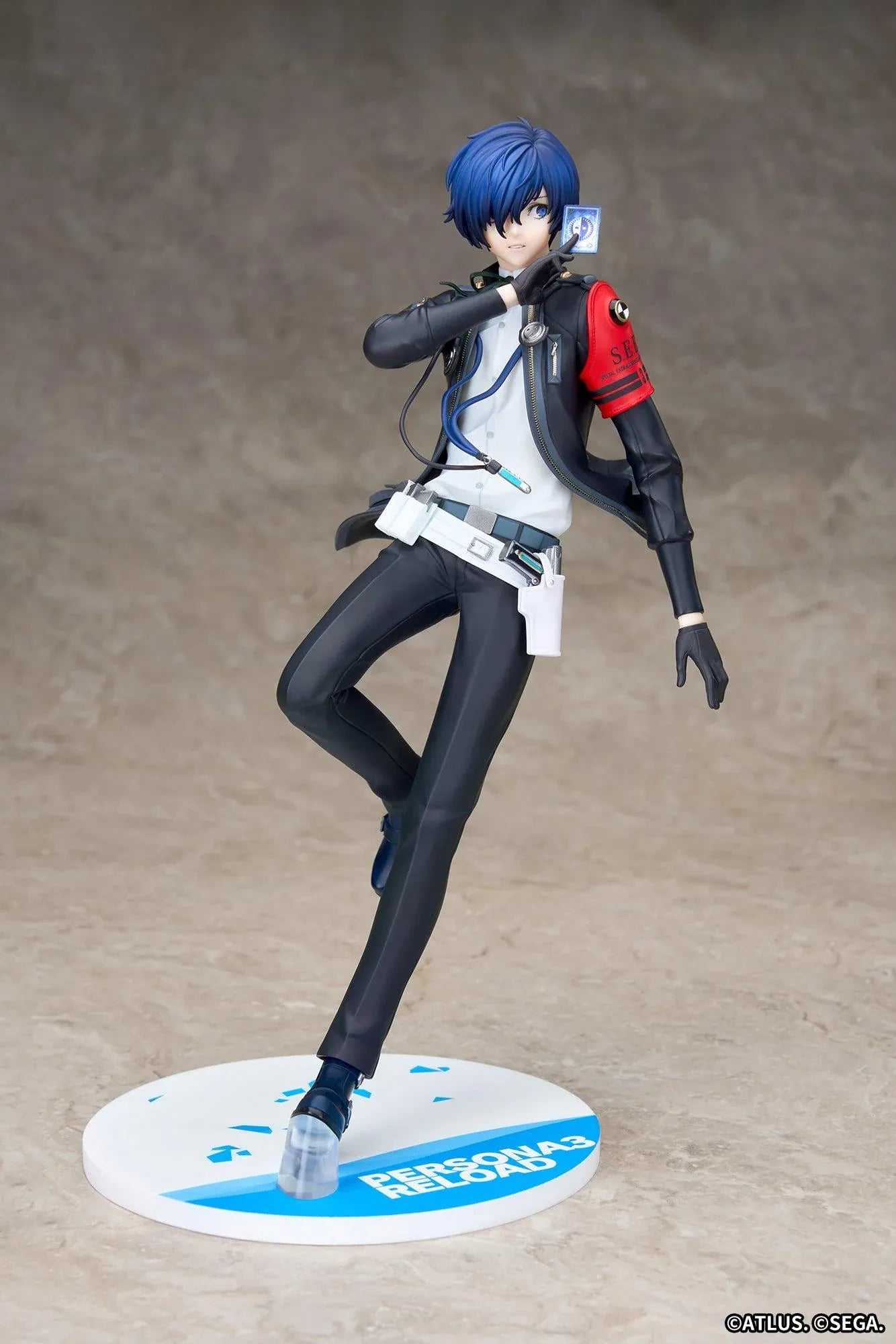 Persona 3 Reload Limepie Protagonist 1/8 Scale Figure with blue hair, black jacket, S.E.E.S. armband, headphones, and themed display base