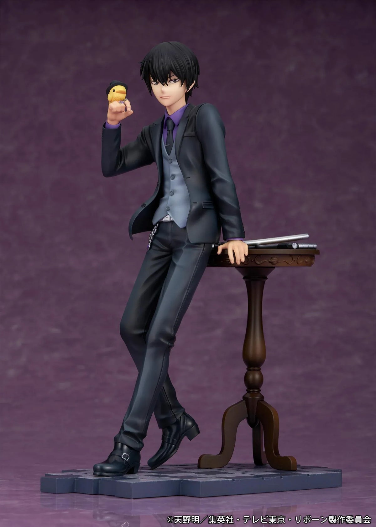 REBORN! Kyoya Hibari Scale Figure featuring a black-haired anime character wearing a black suit, purple shirt, gray vest, and tie, leaning against a wooden table with tonfa weapons while holding his yellow bird companion Hibird.