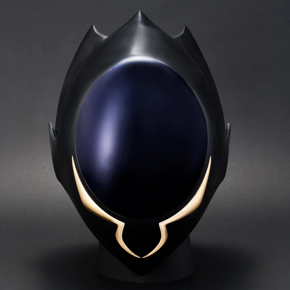 Code Geass Full Scale Works Zero’s Mask 1/1 scale replica with a glossy dark faceplate, gold accents, and an angular outer shell with tall fins.