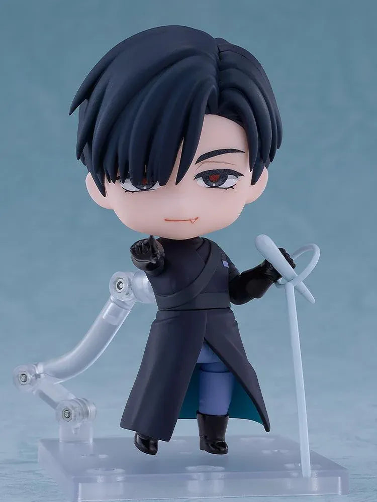 ALIEN STAGE Nendoroid Ivan Figure featuring a black-haired anime character with dark eyes, a small fang, a dark long-sleeved outfit, black gloves, and matching boots while holding a light-blue accessory.