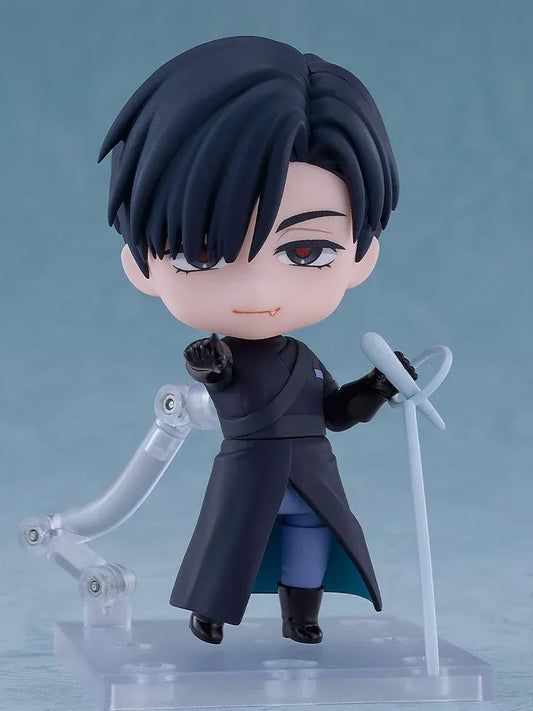ALIEN STAGE Nendoroid Ivan Figure featuring a black-haired anime character with dark eyes, a small fang, a dark long-sleeved outfit, black gloves, and matching boots while holding a light-blue accessory.