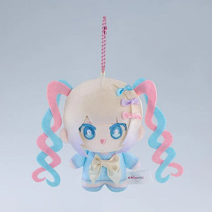 NEEDY GIRL OVERDOSE OMGkawaiiAngel Punipico mascot plushie with pastel spiral twin-tails, blue embroidered eyes, a cream bow, and a pink ball chain.