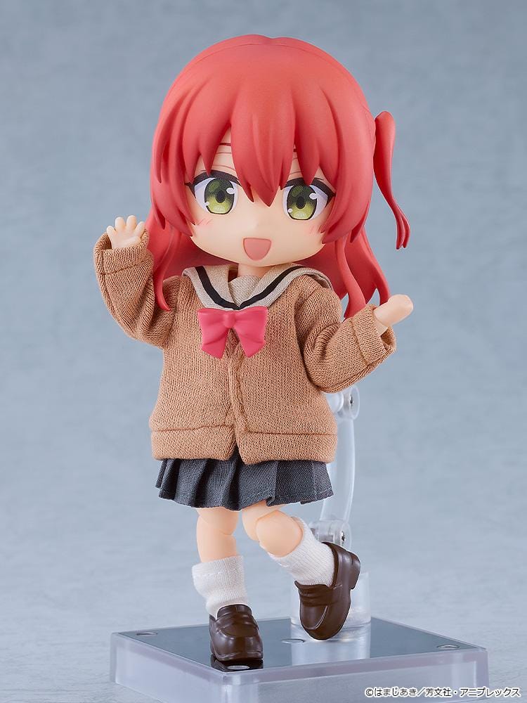 Bocchi the Rock Nendoroid Doll Ikuyo Kita featuring Kita with red hair, green eyes, a fabric cardigan outfit, skirt, socks, and loafers.