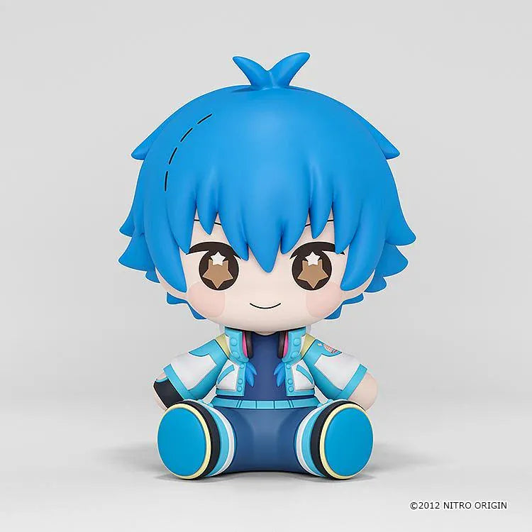 DRAMAtical Murder Huggy Good Smile Aoba figure with blue hair, star-filled eyes, headphones, and a blue-and-white outfit in a seated pose.