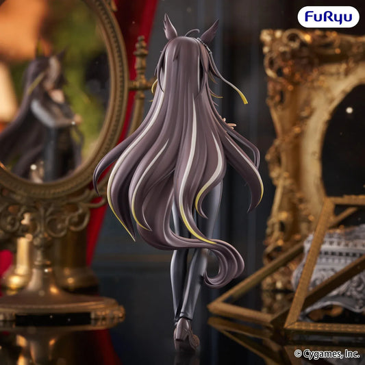 Dream Journey Trio-Try-iT figure wearing glasses, a gray blouse, and dark trousers, with long flowing hair and one hand held near her chin.
