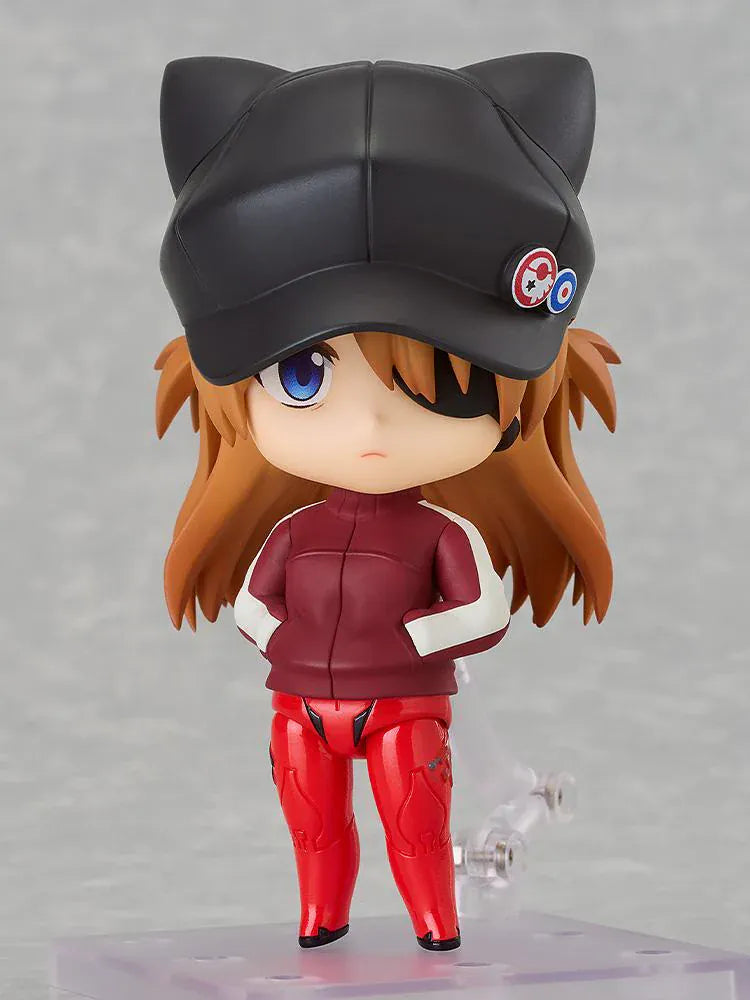 Rebuild of Evangelion Nendoroid Asuka Shikinami Langley Jersey Ver. Figure featuring Asuka in a chibi-style design with orange hair, black cat-ear cap, red jersey outfit, and eyepatch detail.