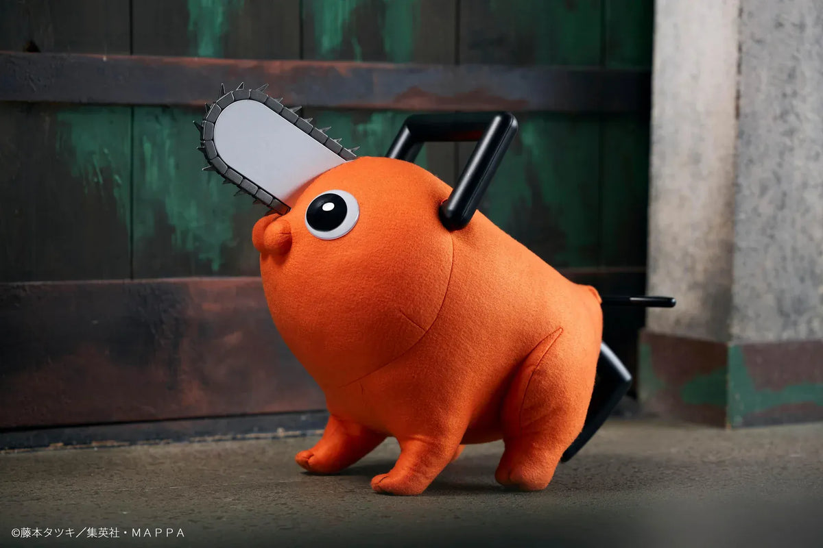 Chainsaw Man life-size Pochita doll figure with an orange body, glossy eyes, chainsaw blade, black handle, and pull cord.