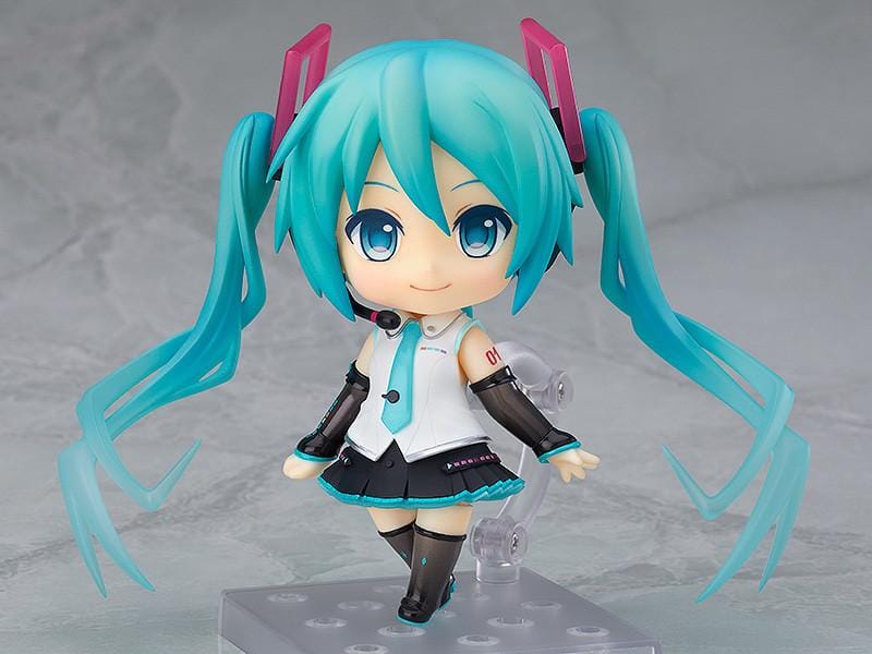 Hatsune Miku Nendoroid Hatsune Miku V4X Figure Rerelease with turquoise twin tails, headset, and black white teal Vocaloid outfit