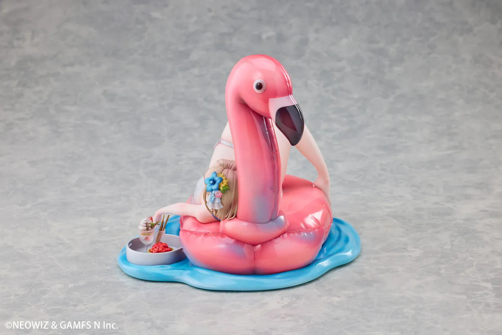 Brown Dust 2 Hot Summer Dream Justia 1/7 Scale Figure relaxing on a pink flamingo float with a water-themed display base