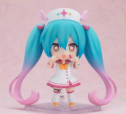 Hatsune Miku Nendoroid MAGICAL CURE LOVE SHOT Figure with teal pink twin-tails, magical nurse outfit, heart details, and starry eyes
