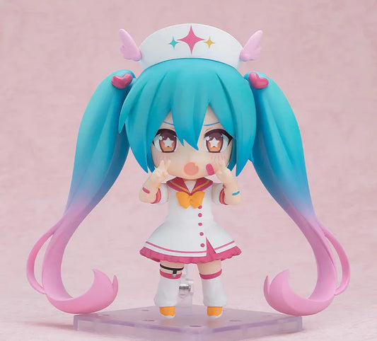 Hatsune Miku Nendoroid MAGICAL CURE LOVE SHOT Figure with teal pink twin-tails, magical nurse outfit, heart details, and starry eyes
