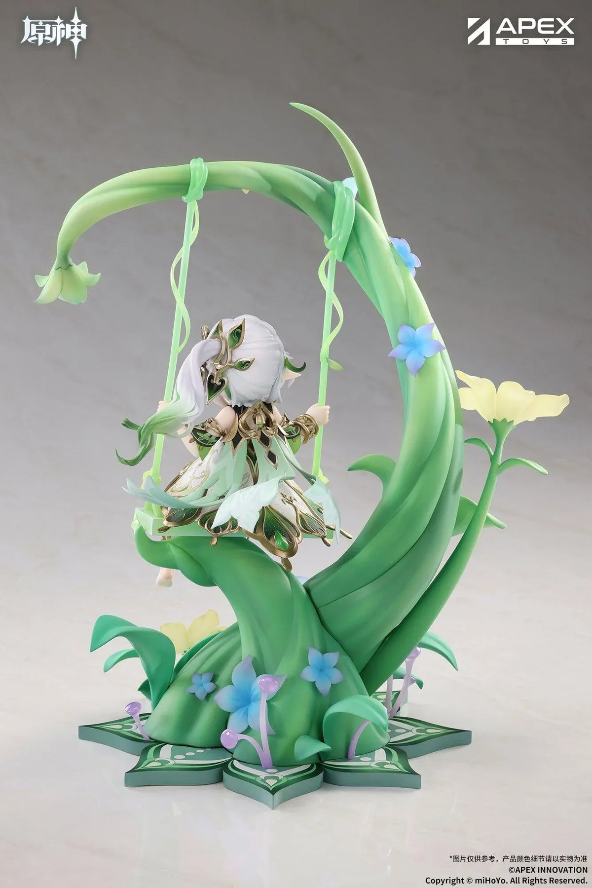 Genshin Impact Nahida Physic of Purity Ver. 1/7 scale figure seated on a green swing surrounded by vines, leaves, and colorful flowers.