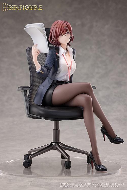 Madoka Higuchi Effortless Work Ver. figure seated in an office chair, wearing a navy blazer and holding papers above a clear circular base.
