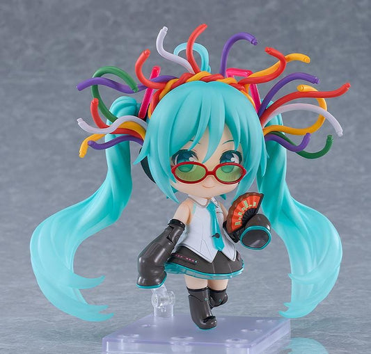 Hatsune Miku Nendoroid Hatsune Miku HMO Ver. Figure featuring Miku with teal twin tails, red glasses, colorful cable-style hair accessories, and music-inspired outfit details.